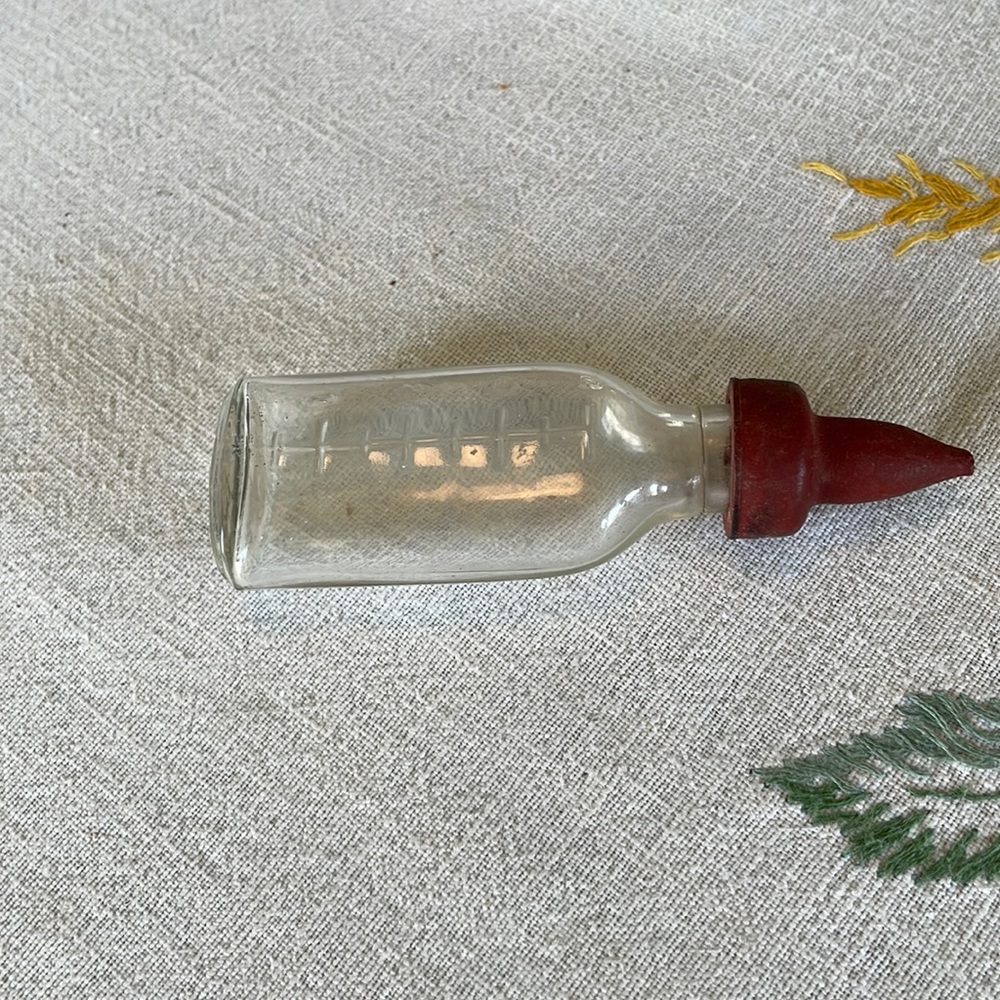 Antique glass baby bottle (for child's doll) with rubber nipple